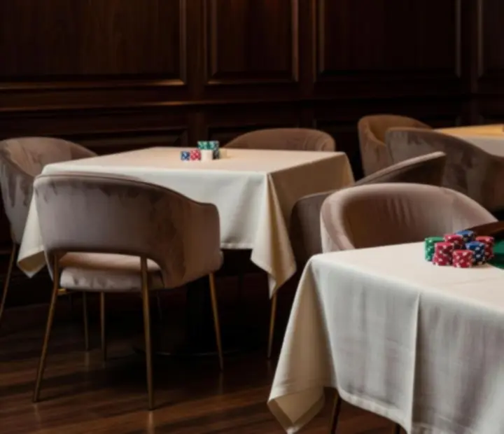 Warm card lounge atmosphere with timber furniture and soft lamplight